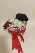 Kinder chocolate bouquet with white ribbon roses and red ribbon bow